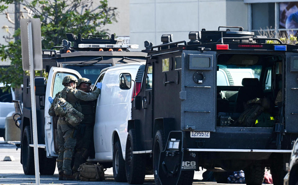 Law enforcement personnel open the door of a van in Torrance, Calif., where the alleged suspect in the mass shooting in which 10 people were killed in Monterey Park is believed to be holed up on Jan. 22, 2023. (Robyn Beck / AFP - Getty Images)