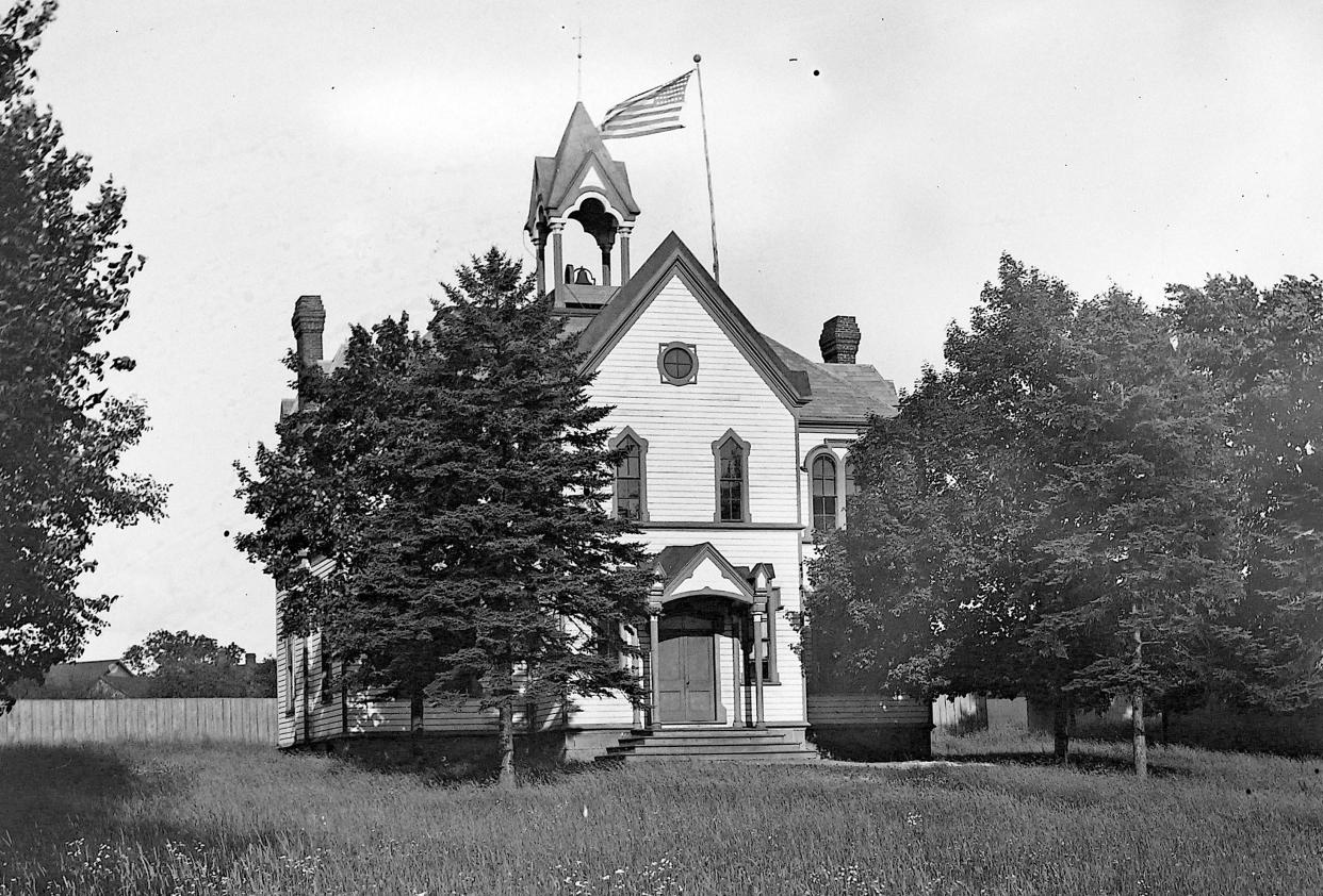 Is the building with the bell tower a church, school or town hall? Does it still stand in Northeast Ohio?