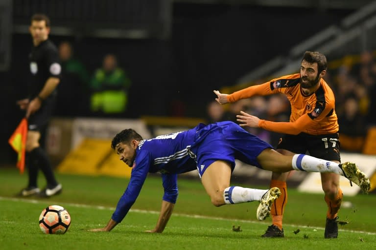 Wolverhampton Wanderers' Jack Price (R) vies with Chelsea's Diego Costa during their English FA Cup fifth round football match on February 18, 2017