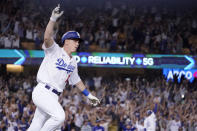 Los Angeles Dodgers' Will Smith celebrates as he rounds first after hitting a three-run walk off home run during the ninth inning of a baseball game against the San Francisco Giants Tuesday, July 20, 2021, in Los Angeles. (AP Photo/Mark J. Terrill)