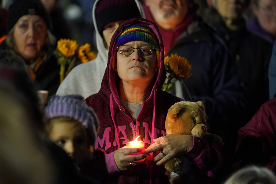 FILE - Community members gather Thursday, Nov. 2, 2023, in Auburn, Maine for a candlelight vigil after the recent mass shooting in Lewiston on Oct. 25, in Auburn, Maine. A special commission organized to investigate the response to the Lewiston, Maine, mass shooting last year is set to hear testimony from more police on Thursday, Feb. 8, 2024. (AP Photo/Matt York, File)