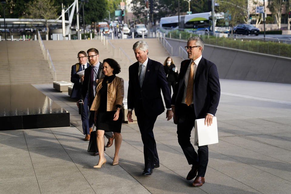 FILE - U.S. Rep. Jeff Fortenberry, R-Neb., center right, and wife, Celeste, arrive at the federal courthouse in Los Angeles, Wednesday, March 16, 2022. On Tuesday, Dec. 26, 2023, an appellate court reversed a 2022 federal conviction against Fortenberry, ruling that he should not have been tried in Los Angeles. (AP Photo/Jae C. Hong, File)