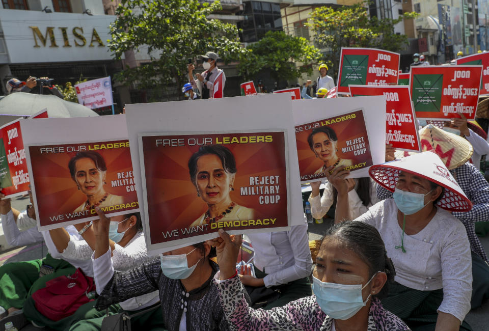 Anti-coup protesters stage a sit-in protest after police blocked their march in Mandalay, Myanmar, Wednesday, Feb. 24, 2021. Protesters against the military's seizure of power in Myanmar were back on the streets of cities and towns on Wednesday, days after a general strike shuttered shops and brought huge numbers out to demonstrate. (AP Photo)