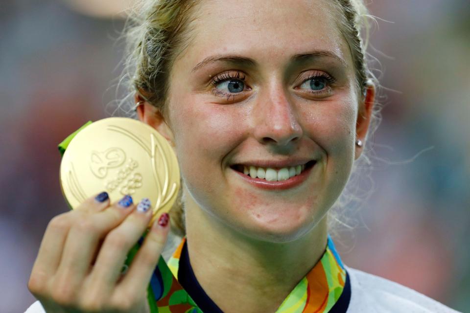 FILE - Gold medalist Laura Trott of Britain poses on the podium of the women's omnium cycling event at the Rio Olympic Velodrome during the 2016 Summer Olympics in Rio de Janeiro, Brazil, Tuesday, Aug. 16, 2016. Multiple Olympic champion Laura Kenny has announced her retirement from cycling because she wants to spend more time at home with her family. The 31-year-old Kenny is Britain’s most successful female Olympic athlete after winning five gold medals. (AP Photo/Patrick Semansky, File)