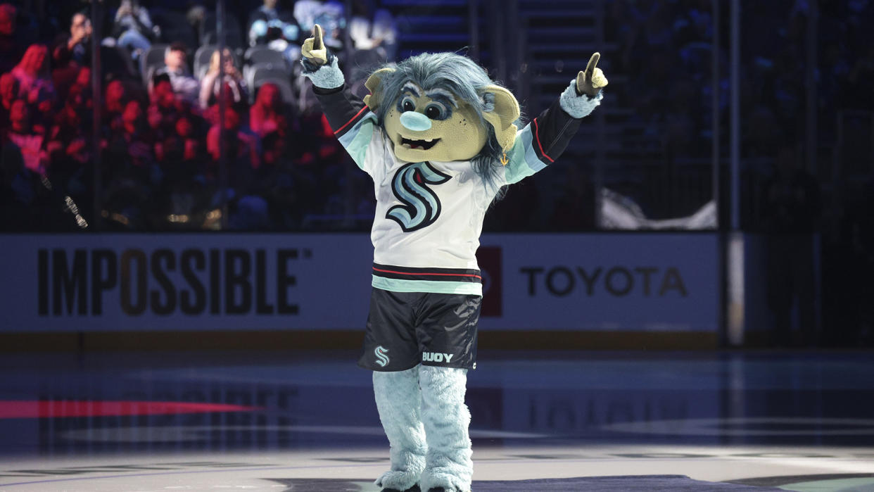 Seattle Kraken mascot Buoy is introduced before the team's preseason game against the Vancouver Canucks. (AP Photo/Jason Redmond)