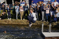 Nelly Korda jumps into the lake after winning the Chevron Championship LPGA golf tournament Sunday, April 21, 2024, at The Club at Carlton Woods in The Woodlands, Texas. (AP Photo/David J. Phillip)