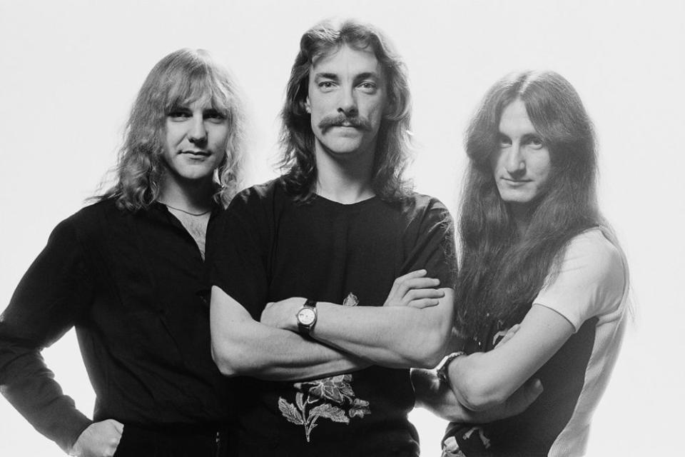 Alex Lifeson, Neil Peart and Geddy Lee | Fin Costello/Redferns/Getty