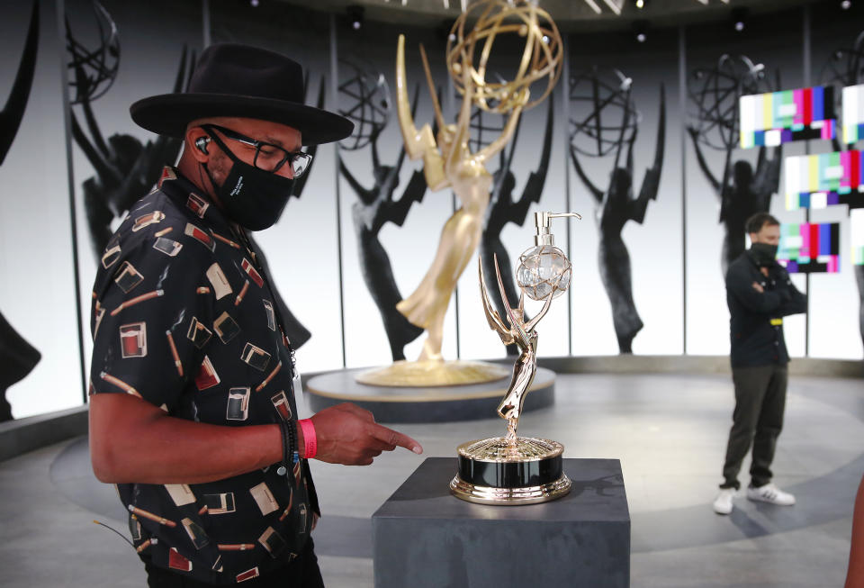 Checking out the Emmy hand sanitizer dispenser.  (Photo: Al Seib via Getty Images)