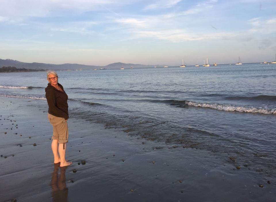 The author with her feet in the Pacific Ocean in Santa Barbara, California (2017). (Photo: Courtesy of Tricia Stewart Shiu)