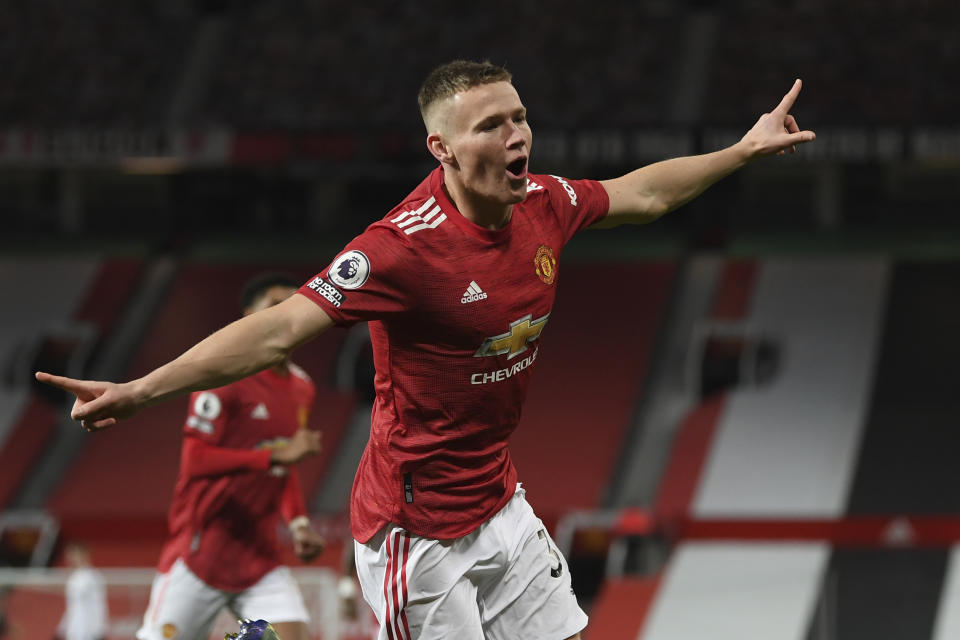 Manchester United's Scott McTominay celebrates his side's second goal during an English Premier League soccer match between Manchester United and Leeds United at the Old Trafford stadium in Manchester, England, Sunday Dec. 20, 2020. (Michael Regan/Pool via AP)