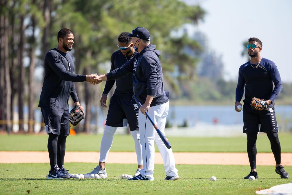 Tigers infielder Jeimer Candelario and manager AJ Hinch shake hands at Joker Marchant Stadium in Lakeland, Florida, on Saturday, Feb. 20, 2021.