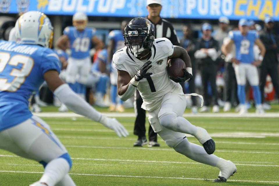 Jacksonville Jaguars running back Travis Etienne Jr. runs against the Chargers.