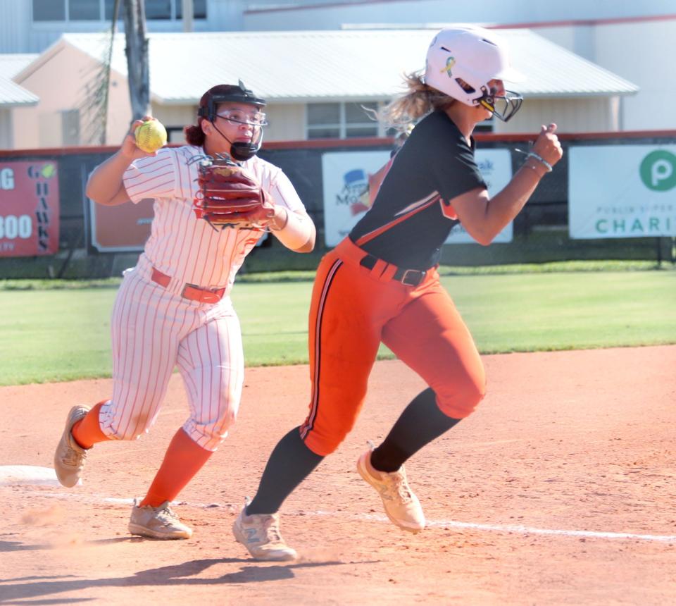 University High's Gianna Hall #7 chases Spruce Creek High's Mackenzie Colby #13, Tuesday May 2, 2023 during semi finals at Spruce Creek High.