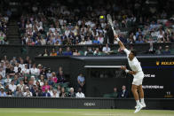 Serbia's Novak Djokovic serves to Tim van Rijthoven of the Netherlands during a men's fourth round singles match on day seven of the Wimbledon tennis championships in London, Sunday, July 3, 2022.(AP Photo/Kirsty Wigglesworth)