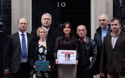 Yvonne McHugh, centre, the girlfriend of Billy Irving who is being held in a prison in Chennai in India, is joined by family members of other prisoners of the so-called Chennai Six ahead of the verdict in their appeal - Credit: Stefan Rousseau/PA