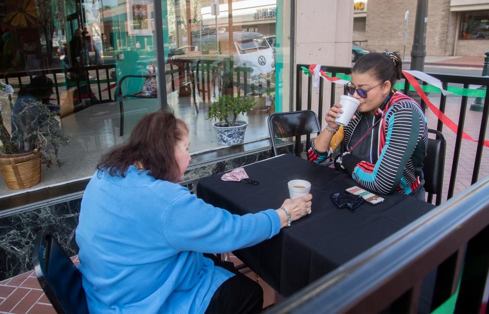(3/5/21)Kathleen Galas, left, and her niece Annemarie Hohn drink their coffee at an invitation only coffee-tasting event at Terra Coffee in the Mexican Heritage Center in downtown Stockton. CLIFFORD OTO/THE STOCKTON RECORD