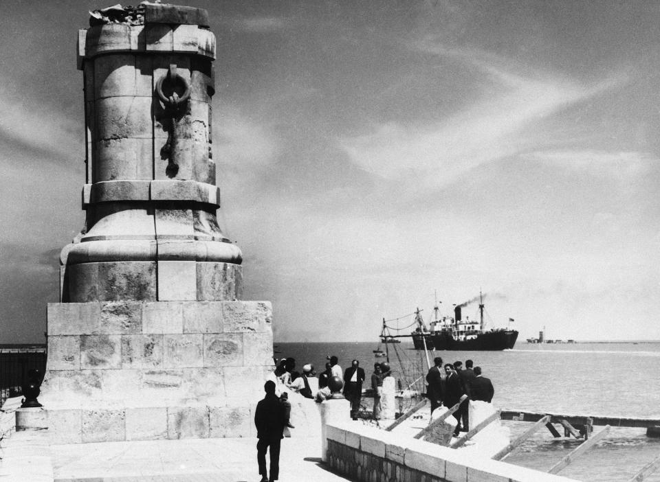 FILE - This March 30, 1957 file photo, shows the base of the statue of Suez Canal builder Ferdinand de Lesseps is all that remains at Port Said, Egypt, after control of the canal was seized by Egyptian President Nasser in 1956. A proposal to bring back the statue has stirred controversy in Egypt with many saying it would be a salute to colonial times and a “humiliation" to the memory of tens of thousands of Egyptian laborers who died while digging the waterway. The debate started when a newspaper reported in June 2020 that local authorities in the Mediterranean province of Port Said were thinking of returning the statue to where it once stood at the northern entrance of the canal. (AP Photo, File)