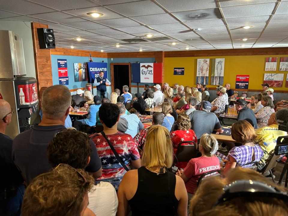 Gov. Ron DeSantis speaks to a packed Pizza Ranch in Garner on Aug. 26, 2023.