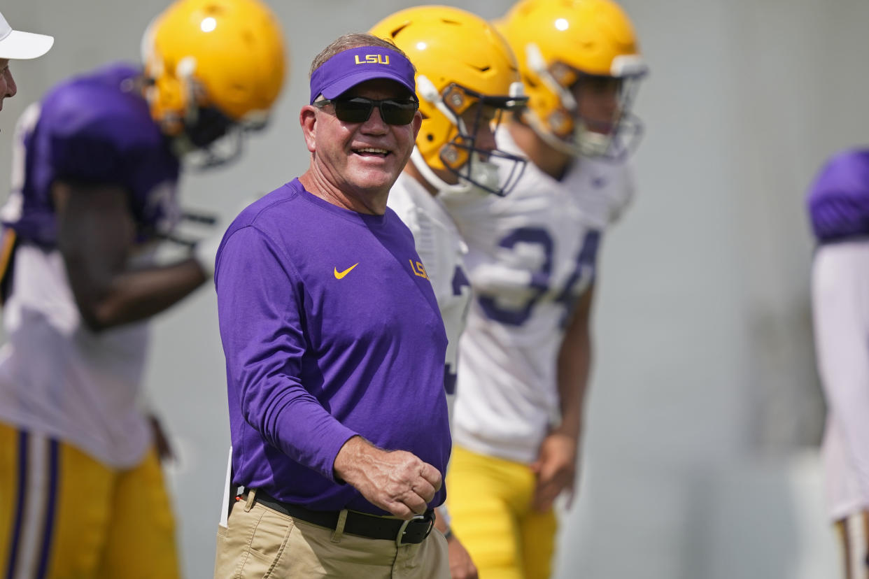 LSU head coach Brian Kelly runs their NCAA college football practice in Baton Rouge, La., Wednesday, Aug. 17, 2022. (AP Photo/Gerald Herbert)