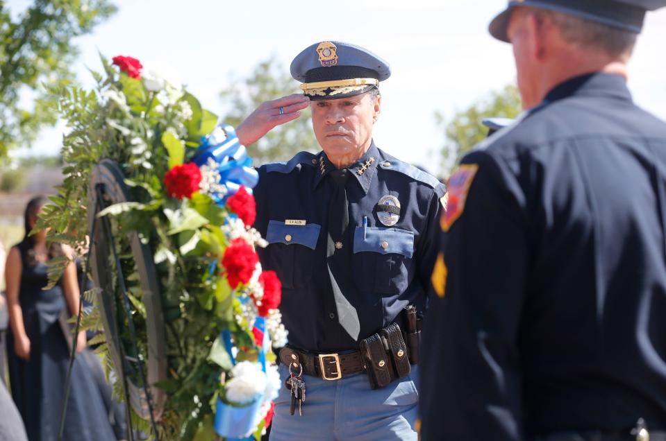 El Paso police Chief Greg Allen salutes during the laying of the wreath at the Police Memorial on May 19, 2017, during a ceremony honoring officers who gave their lives in the line of duty.