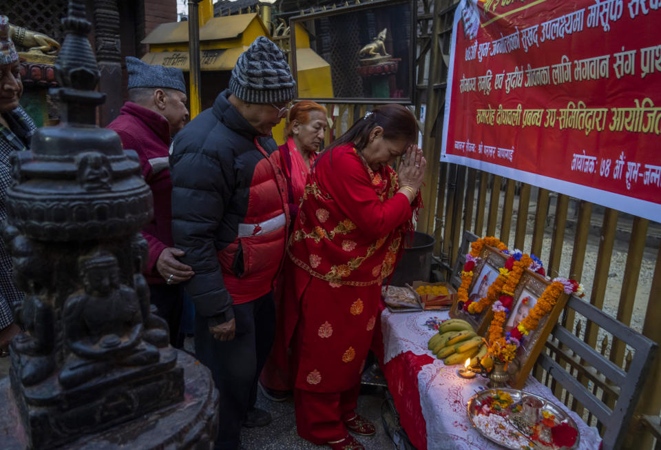 Supporters light candles and worship before photographs former king Gyanendra and former queen Komal Rajya Laxmi Shah as they celebrate the former queen's birthday in Kathmandu, Nepal, Feb. 29, 2024. Nepal’s once unpopular monarchy — abolished after centuries of rule over the Himalayan nation — is hoping to regain some of its lost glory. Royalist groups and supporters of former King Gyanendra have been holding rallies to demand the restoration of the monarchy and the nation’s former status as a Hindu state. (AP Photo/Niranjan Shrestha)