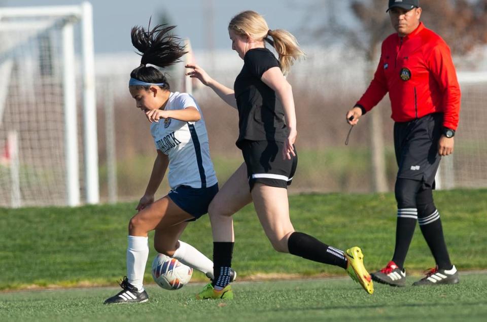 Turlock’s Isis Cosio, left, and Enochs’ Kendall Cushing battle for the ball during a Central California Athletic League game at Mary Grogan Park in Modesto, Calif., Wednesday, Jan. 23, 2023.