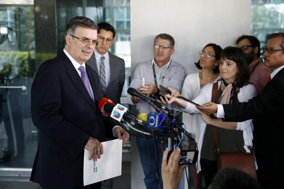 Mexico's Foreign Secretary Marcelo Ebrard, left, speaks with reporters, Thursday, May 23, 2019, after meeting with Secretary of State Mike Pompeo at the U.S. State Department in Washington. (AP Photo/Patrick Semansky)