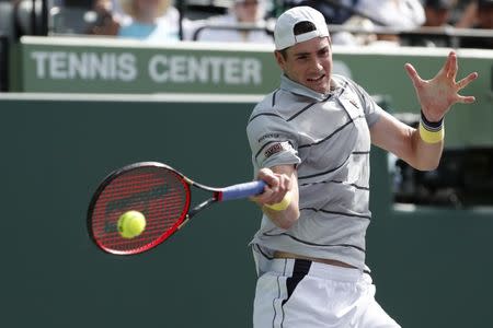 Mar 28, 2018; Key Biscayne, FL, USA; John Isner of the United States hits a forehand against Hyeon Chung of Korea (not pictured) on day nine at the Miami Open at Tennis Center at Crandon Park. Isner won 6-1. 6-4. Mandatory Credit: Geoff Burke-USA TODAY Sports