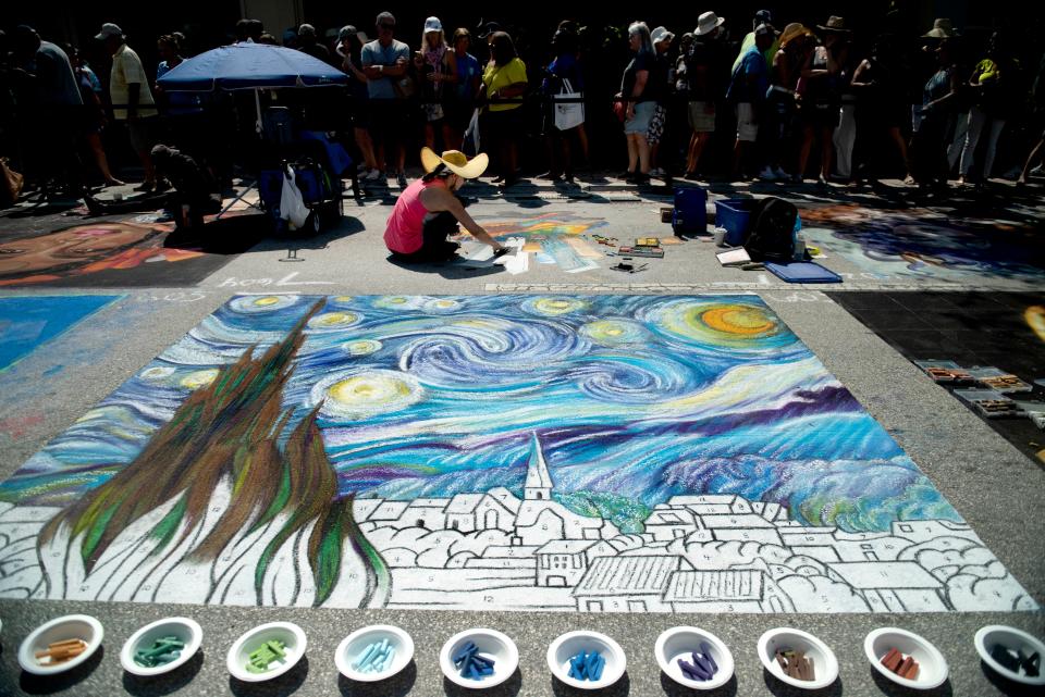 Thousands attend the Lake Worth Beach annual Street Painting Festival in Lake Worth Beach in February 2023, which included a re-creation of Vincent van Gogh's "The Starry Night."