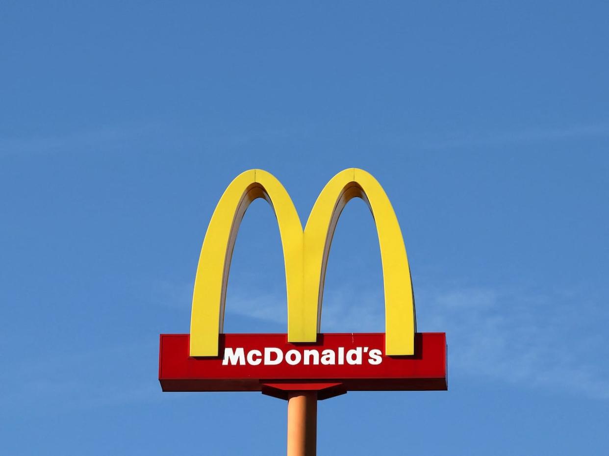 A sign for the U.S. fast-food restaurant chain McDonald's is seen outside one of its restaurants in Sint-Pieters-Leeuw, near Brussels, on Sept. 5. (Yves Herman/Reuters - image credit)