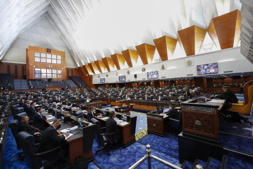 Malaysia's members of parliament attend a session of the lower house of parliament in Kuala Lumpur, Malaysia, Monday, July 13, 2020. (AP Photo/Vincent Thian)