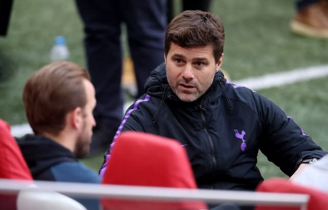 Mauricio Pochettino, right, chats with Harry Kane in Amsterdam