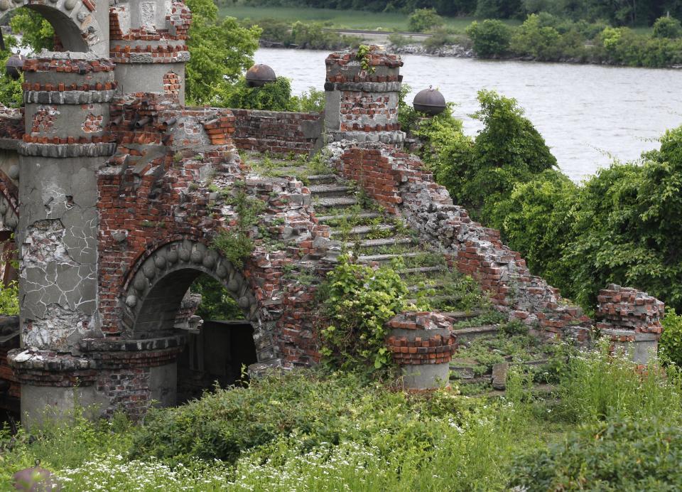 A staircase of the Bannerman's Island Arsenal is seen on Pollepel Island, N.Y., on Tuesday, June 5, 2012. Though it looks like it was built to withstand battering rams, it was actually a surplus military goods warehouse made to resemble a Scottish castle. Businessman Francis Bannerman VI had it built early in the 20th century as a place to store helmets, haversacks, mess kits and munitions he could not store in his thriving shop in Manhattan. (AP Photo/Mike Groll)