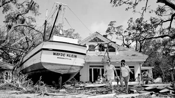 PHOTO: An 85-foot boat was deposited in the yard of a home in Biloxi, Miss., as part of the wreckage of Hurricane Camille. The boat's anchorage is more than 100 yards from the home and floated in on flood tides. (Joe Holloway Jr./AP, FILE)