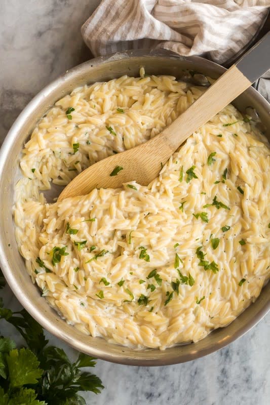 <p>The Recipe Rebel</p><p>A one-pot recipe for tender orzo tossed in a light and cheesy cream sauce.</p><p><strong>Get the recipe: </strong><a href="https://www.thereciperebel.com/garlic-parmesan-orzo-pasta/?fbclid=IwAR15lahsIyx3x051MQDUl9xKYrIO-xUz_swaC53gqIj5buFV6EdOpA9qWJc" rel="nofollow noopener" target="_blank" data-ylk="slk:Garlic Parmesan Orzo Pasta;elm:context_link;itc:0;sec:content-canvas" class="link rapid-noclick-resp"><strong>Garlic Parmesan Orzo Pasta</strong></a></p>