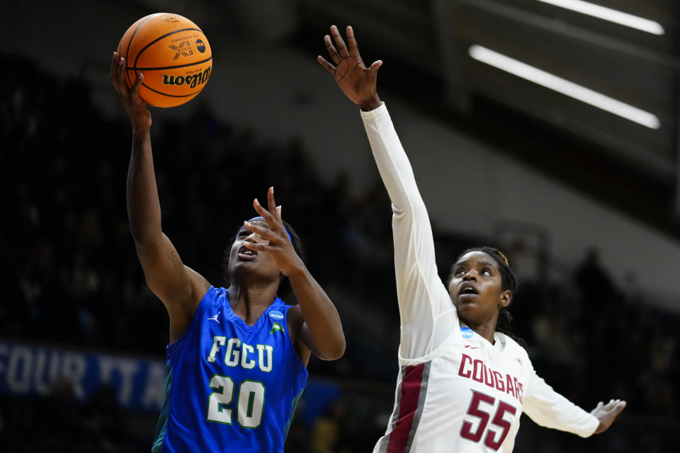 Florida Gulf Coast's Sha Carter (20) goes for a shot against Washington State's Bella Murekatete during the second half of a first-round college basketball game in the NCAA Tournament, Saturday, March 18, 2023, in Villanova, Pa. (AP Photo/Matt Rourke)