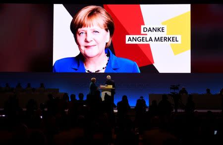 German Chancellor Angela Merkel attends Christian Democratic Union (CDU) party congress in Hamburg, Germany, December 7, 2018. The sign reads: "Thank you Angela Merkel". REUTERS/Fabian Bimmer