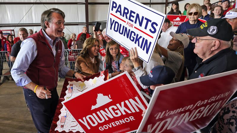 Republican gubernatorial candidate Glenn Youngkin, left, and his wife Suzanne, second from left, greet supporters during a rally in Chesterfield, Va., on Nov. 1, 2021. Some observers say Youngkin won the 2021 gubernatorial election on a parents’ rights platform. The issue of parents’ rights could play a central role in the primaries and 2024 general election.