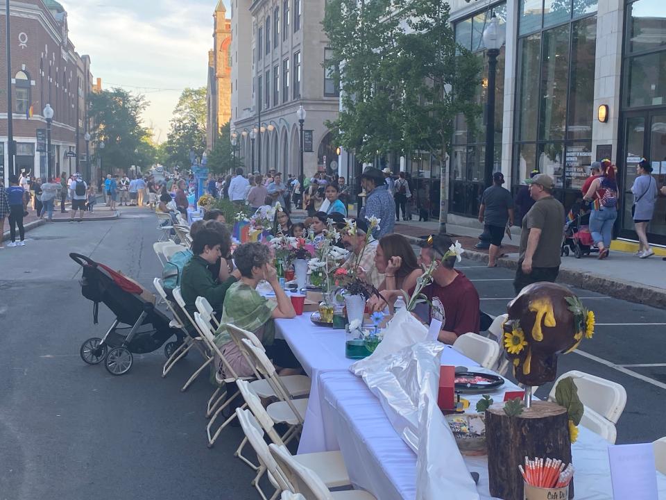20mi2 hosts its Colossal commUNITY Table for 500 people on Purchase Street on Thursday in New Bedford.