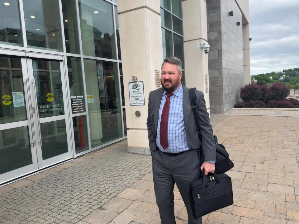 Clarke Tedesco, a civil litigation lawyer with the Toronto-based firm of Crawley MacKewn Brush LLP and part of the team representing American Iron & Metal, leaves the Saint John courthouse on Tuesday afternoon. 