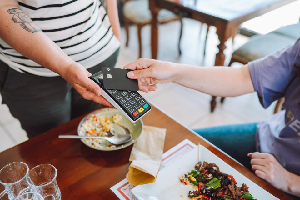 Paying for food and drinks at cafe made easy with credit cards.