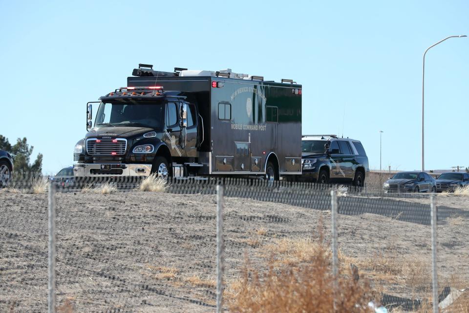 A New Mexico State Police mobile command post is stationed near the Motel Boulevard exit off Interstate 10 on Thursday, Feb. 4, 2021. A multiagency investigation is underway after a state police officer was shot and killed.