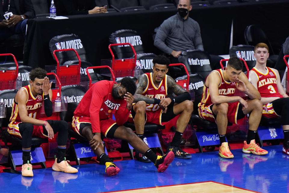 Atlanta Hawks' players watch from the bench during the final seconds of Game 2 in a second-round NBA basketball playoff series against the Philadelphia 76ers, Tuesday, June 8, 2021, in Philadelphia. (AP Photo/Matt Slocum)