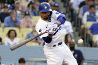 Los Angeles Dodgers' Mookie Betts singles during the first inning of the team's baseball game against the Los Angeles Angels on Friday, Aug. 6, 2021, in Los Angeles. (AP Photo/Marcio Jose Sanchez)