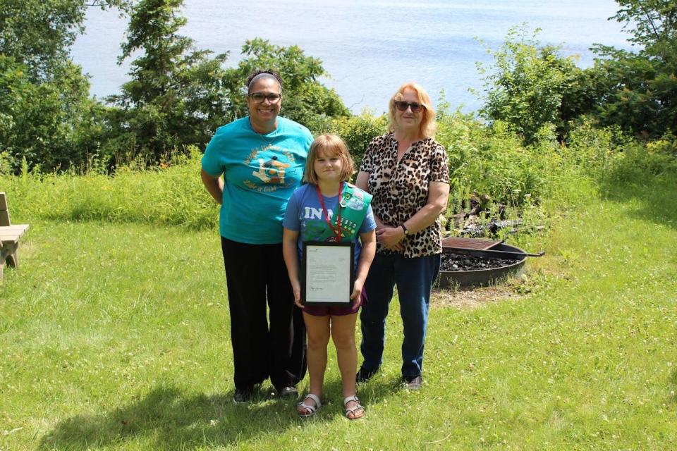 Aspyn Osse of Cudahy received the Girl Scouts National Lifesaving Medal of Honor June 26 after she saved her grandmother's life. Pictured (from left) are Ana Simpson, CEO of Girl Scouts of Wisconsin Southeast, Osse, and Harriet Miller, Aspyn's grandmother.