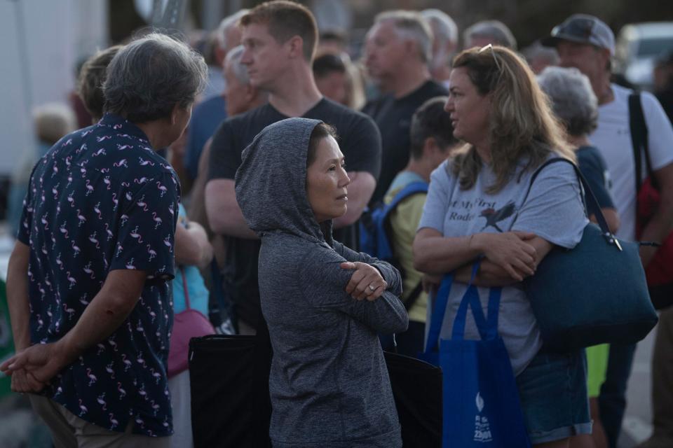 Many Fort Myers Beach residents and business owners wait in line to be bussed onto Fort Myers Beach for the first time on Saturday, October 8, 2022 after the island was closed off after Hurricane Ian hit the community. Saul Young/Knoxville News Sentinel-USA TODAY NETWORK