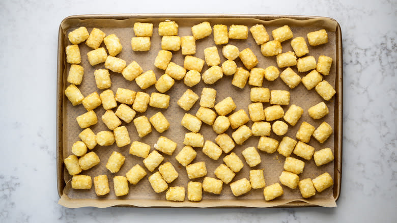 tater tots on baking sheet