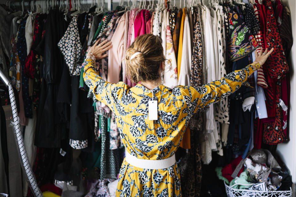 woman looking through her closet