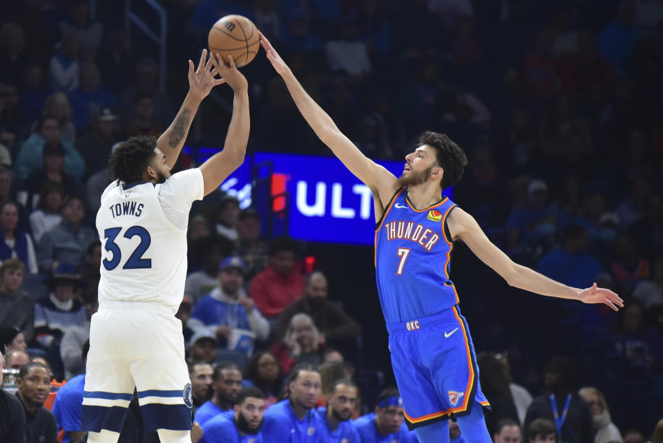 Oklahoma City Thunder forward Chet Holmgren (7) blocks a shot by Minnesota Timberwolves center Karl-Anthony Towns (32) in the second half of an NBA basketball game, Tuesday, Dec. 26, 2023, in Oklahoma City. (AP Photo/Kyle Phillips)