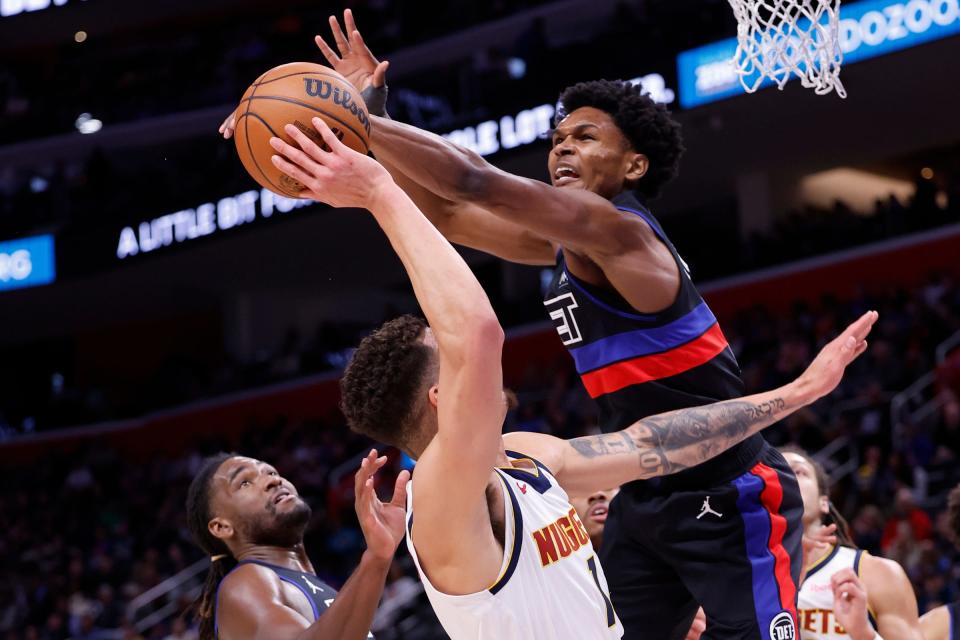 Pistons forward Ausar Thompson blocks a shot by Nuggets forward Michael Porter Jr. in the first half of the Pistons' 107-103 loss on Monday, Nov. 20, 2023, at Little Caesars Arena.